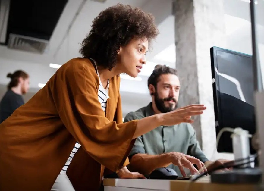 Technology professionals in active discussion — future leadership and AI
